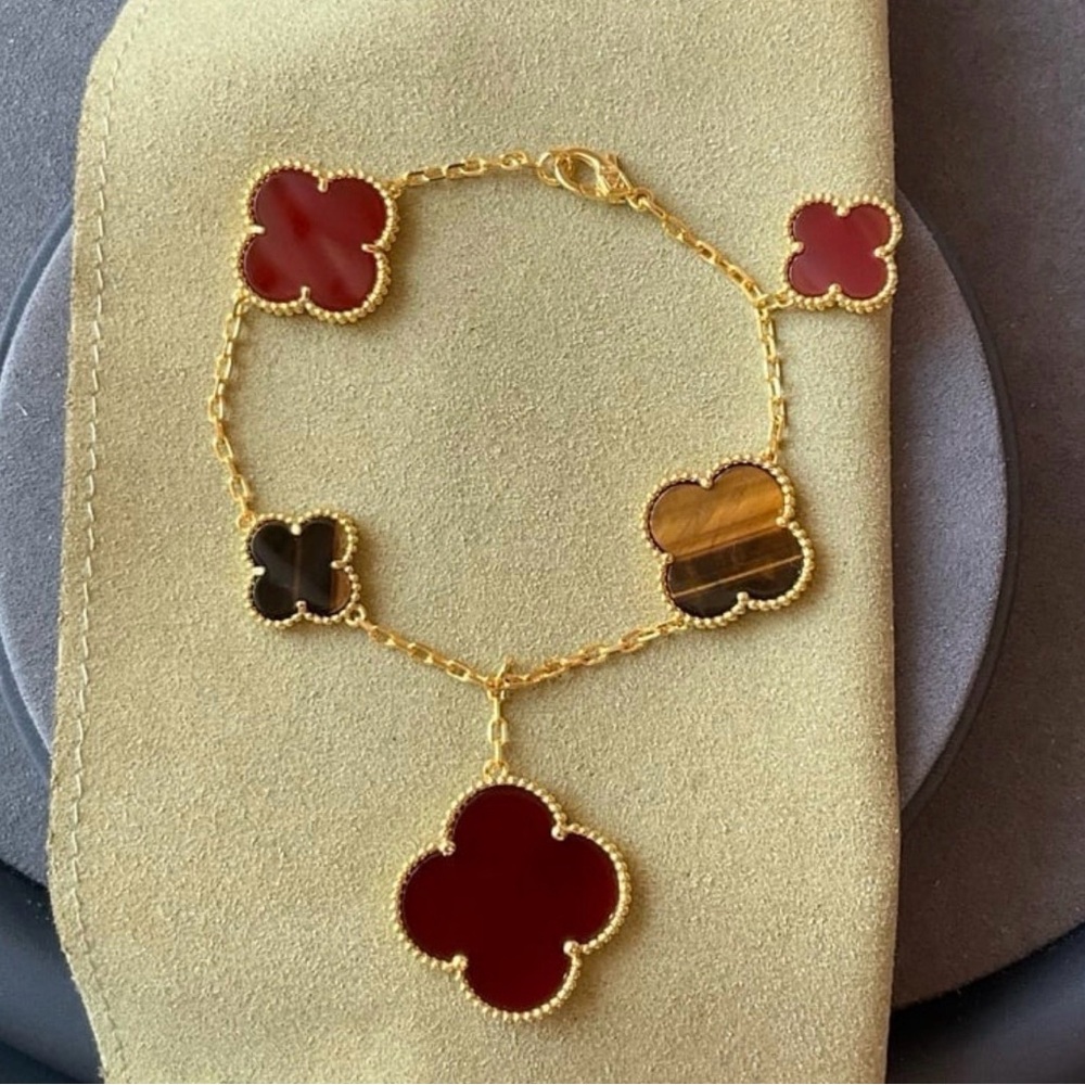 Elegant Gold and Red Clover Bracelet